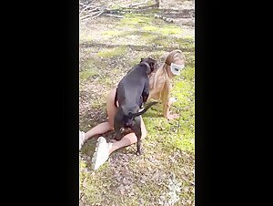 Sweet blonde combines outdoors and dog