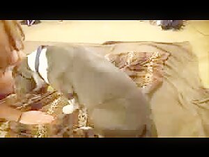 Mature busty woman and her dog